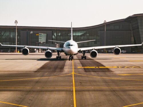 Visa change services in Dubai UAE with airport and aircraft preparing for travel